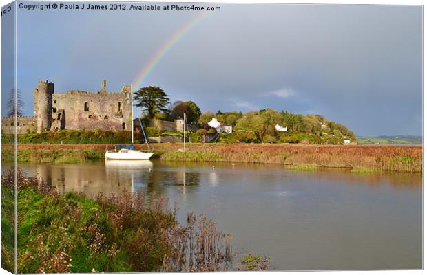 Rainbow over Laugharne Castle Canvas Print by Paula J James