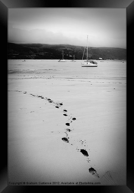 Footsteps in the sand Framed Print by Graham Custance