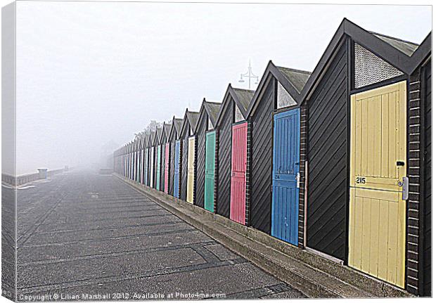 Beach Huts in the fog. Canvas Print by Lilian Marshall