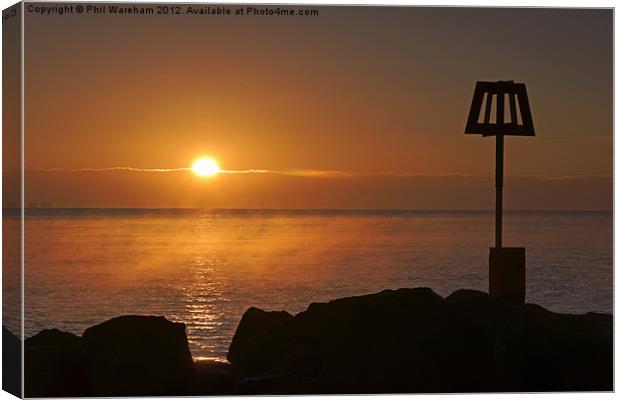 Sunrise over the breakwater Canvas Print by Phil Wareham