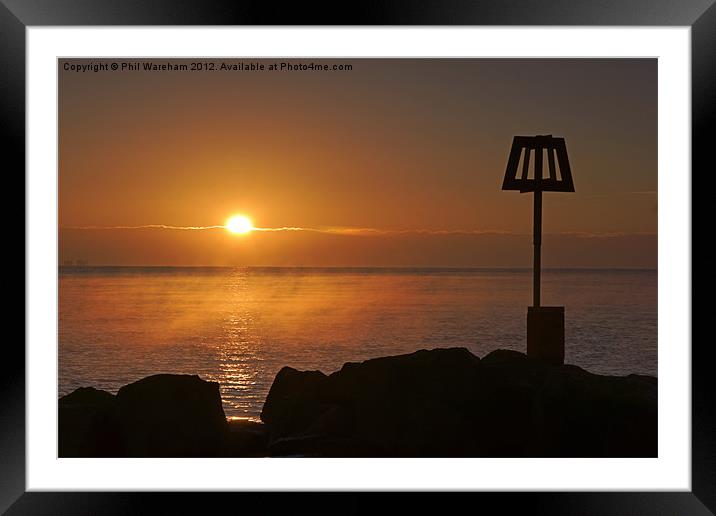 Sunrise over the breakwater Framed Mounted Print by Phil Wareham