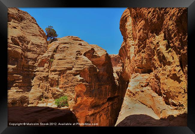 Rocky desert canyon Framed Print by Malcolm Snook