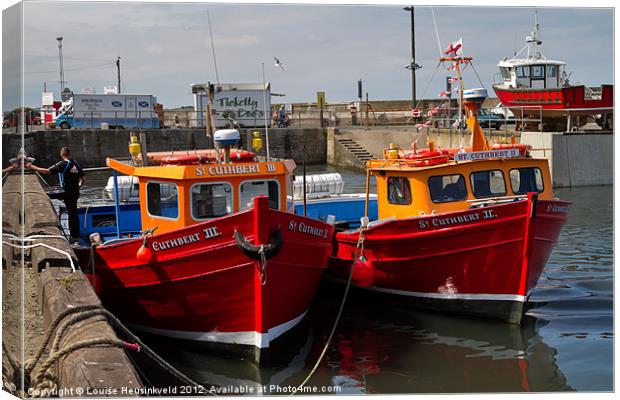 Red Boats, Seahouses, Northumberland Canvas Print by Louise Heusinkveld