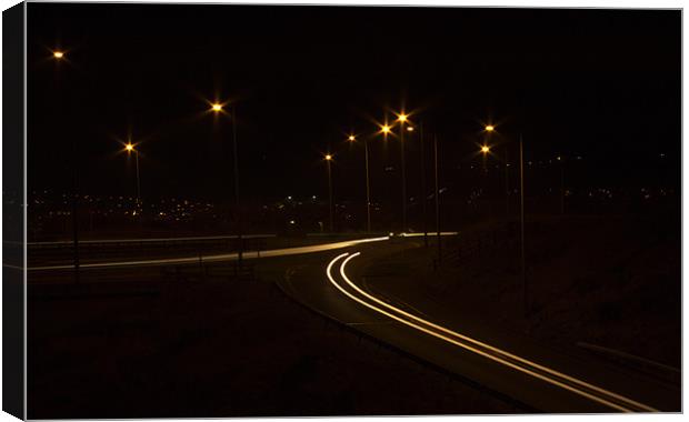 Light trails at the Junction Canvas Print by Peter Elliott 