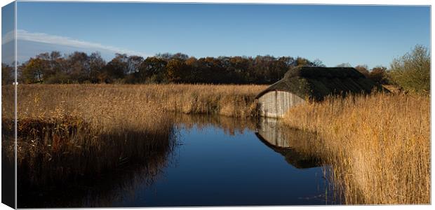 Hickling Boat Shed Canvas Print by Simon Wrigglesworth