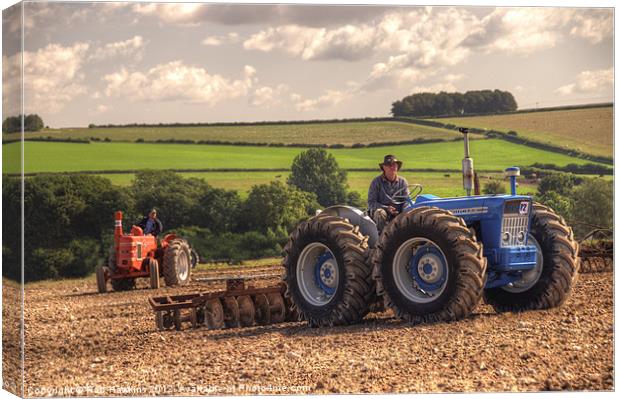 Classic Tractors at work Canvas Print by Rob Hawkins