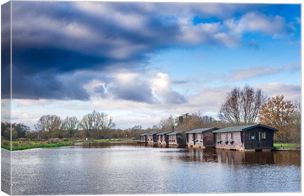 Wooden boathouses Canvas Print by Stephen Mole