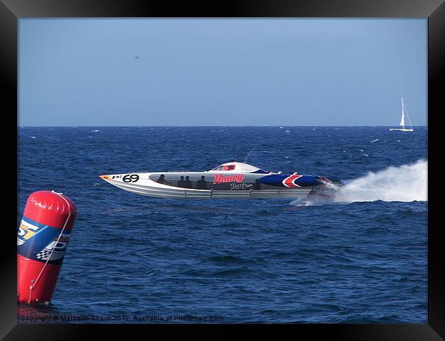 Offshore powerboat at speed Framed Print by Malcolm Snook