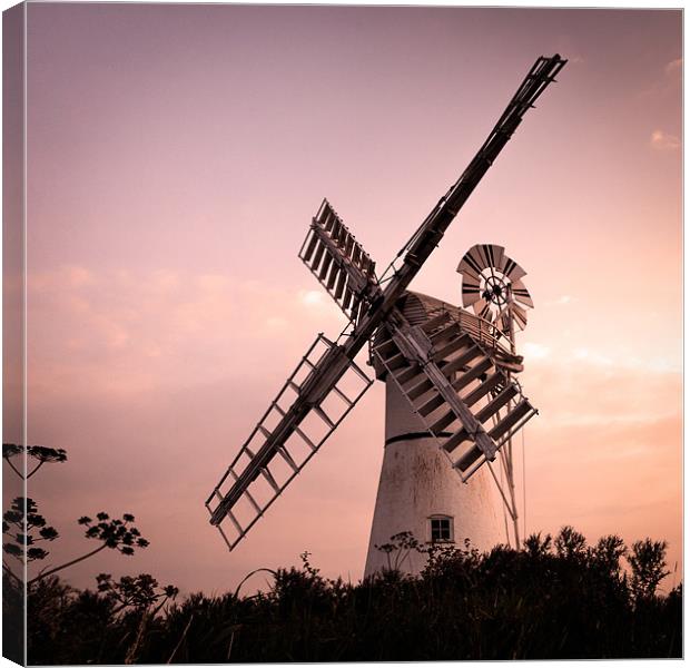 Thurne Windmill at sunset Canvas Print by Simon Wrigglesworth