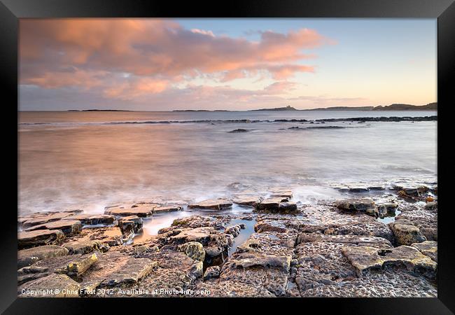 Long way to Dunstanburgh Castle Framed Print by Chris Frost