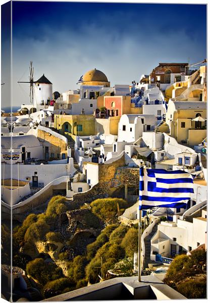 Oia and a greek flag Canvas Print by meirion matthias