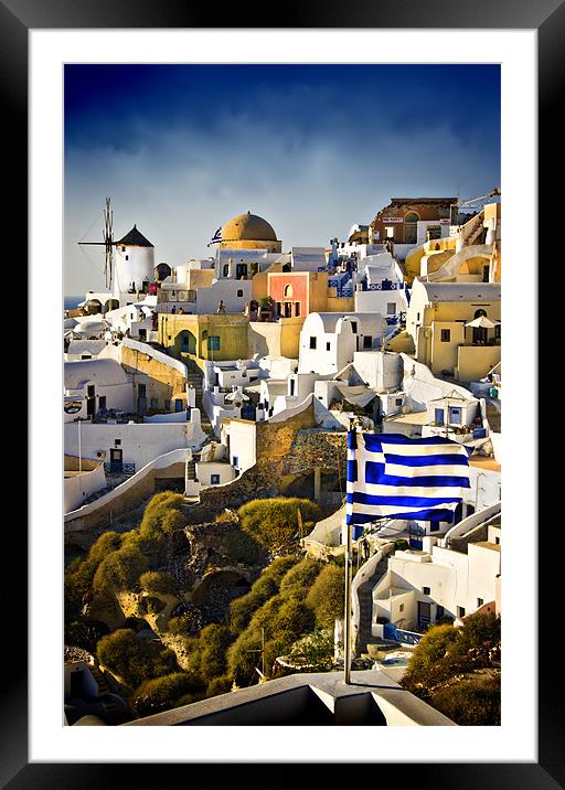 Oia and a greek flag Framed Mounted Print by meirion matthias