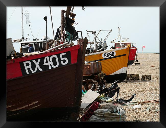 Fishing boats on the shore in Hastings Framed Print by David French