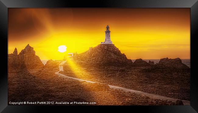 Lighthouse and Sunbeams Framed Print by Robert Pettitt