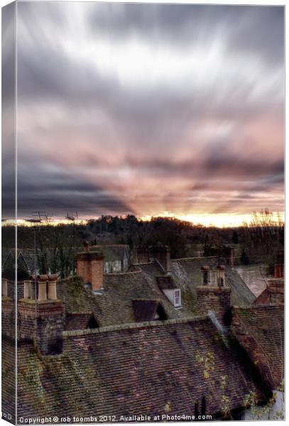 SUNSET OVER ROOF TOPS Canvas Print by Rob Toombs