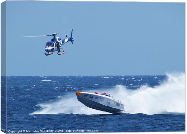 Powerboat and helicopter Canvas Print by Malcolm Snook