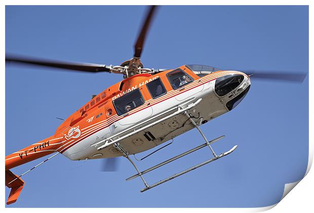 Orange white helicopter hovers over Kashmir Print by Arfabita  