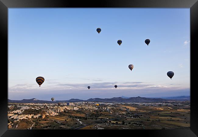 Cappadocia landscape filled with hot air balloons Framed Print by Arfabita  