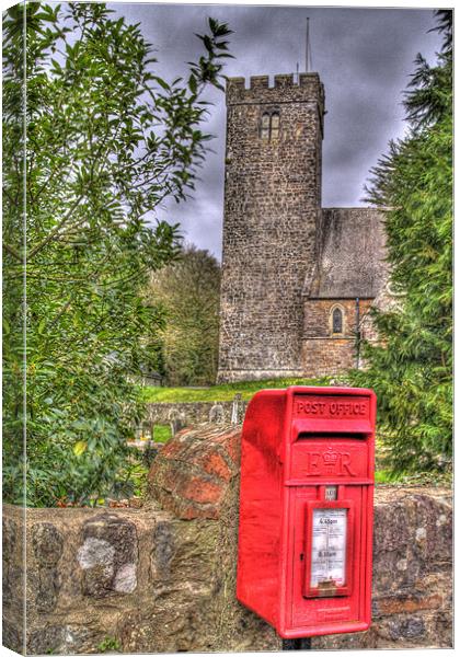 Red Post Box And Church Canvas Print by Steve Duckworth