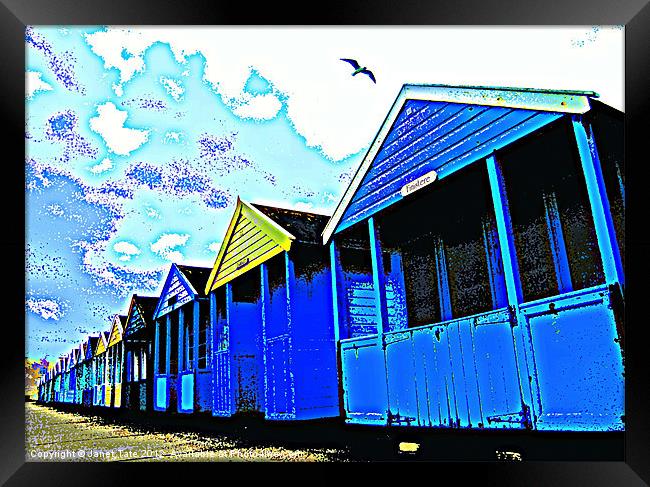 Beach huts with seagull Framed Print by Janet Tate