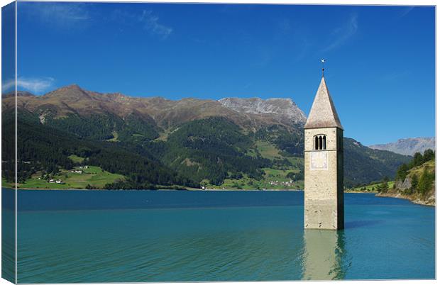 Tower of sunken church in Lago di Resia, Italy Canvas Print by Claudio Del Luongo