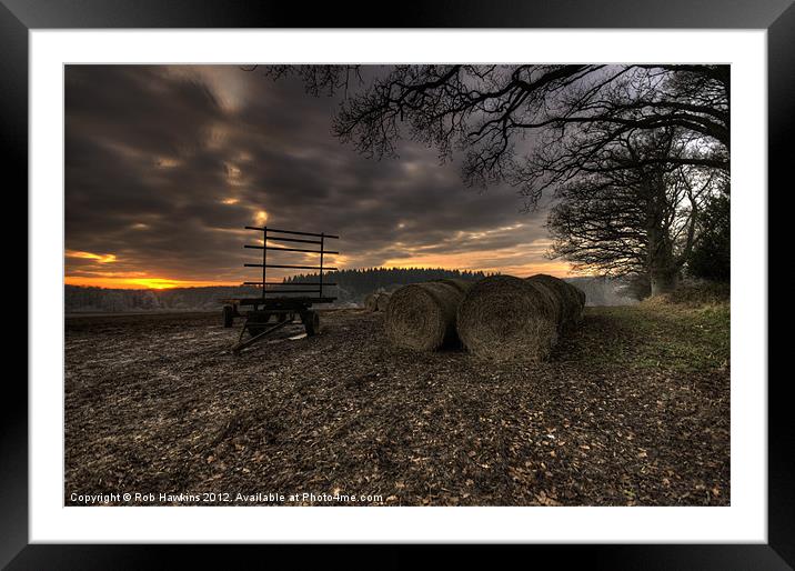 Trailer & the bales at dusk Framed Mounted Print by Rob Hawkins