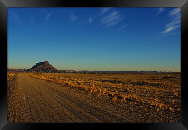 Gravel road to Factory Butte, Utah Framed Print by Claudio Del Luongo