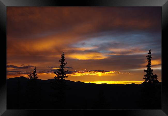 Sun reflection, Rocky Mountains, Colorado Framed Print by Claudio Del Luongo