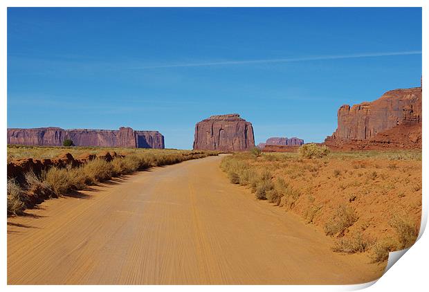 Sand road across Monument Valley, Arizona Print by Claudio Del Luongo