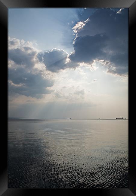 Sunrays scattered by clouds over Trieste Bay Framed Print by Ian Middleton