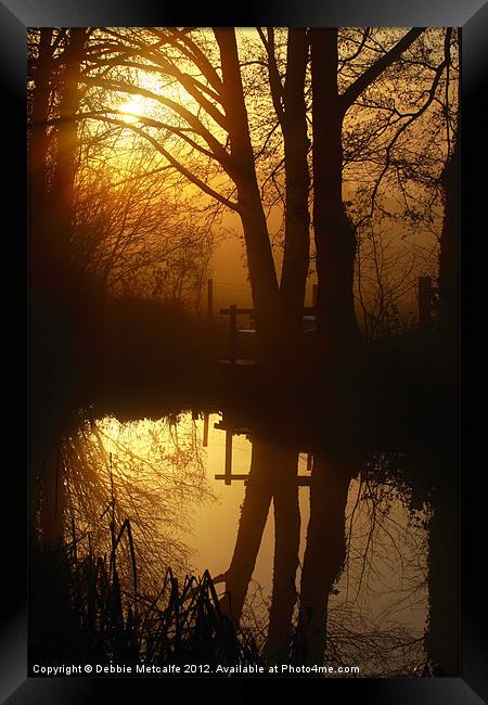 Sunrise with reflections Framed Print by Debbie Metcalfe