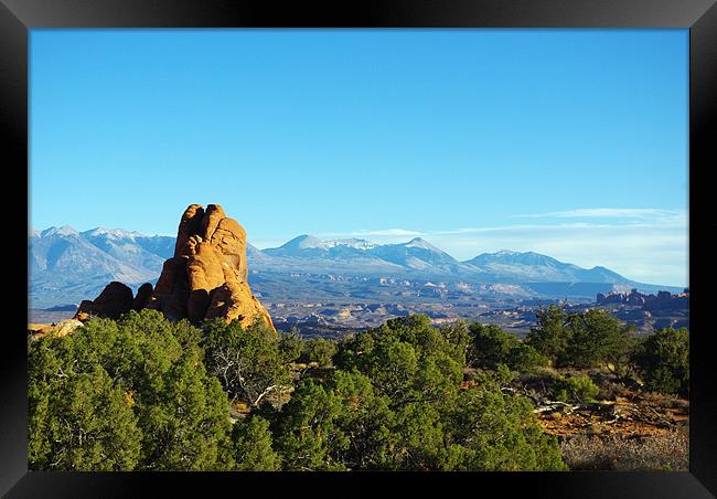 Rocks and Manti La Sal Mountain Framed Print by Claudio Del Luongo