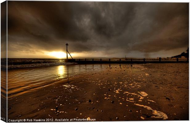 Sunset over the Groynes Canvas Print by Rob Hawkins