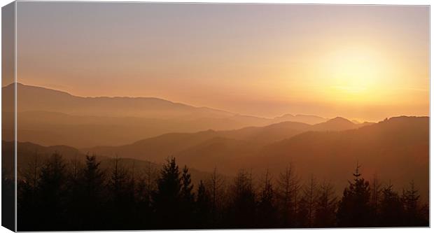 Sunset over welsh mountains  Canvas Print by Mark Chadwick