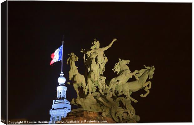 Bronze horses and the flag of France Canvas Print by Louise Heusinkveld