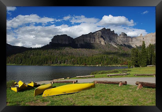 Yellow canoes and Brooks Lake, Wyoming Framed Print by Claudio Del Luongo