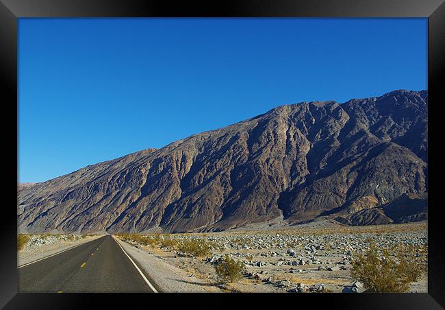 Highway and mountains, Death Valley Framed Print by Claudio Del Luongo