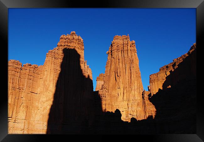 Fisher Towers with climbers Framed Print by Claudio Del Luongo