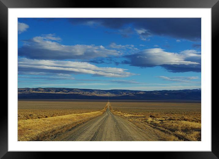 Dirt road through Nevada Framed Mounted Print by Claudio Del Luongo