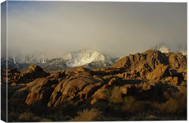 Sun and fog on rocks and Sierra Canvas Print by Claudio Del Luongo