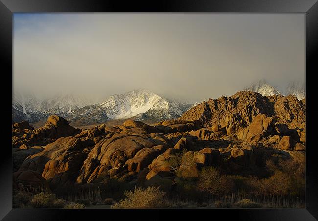 Sun and fog on rocks and Sierra Framed Print by Claudio Del Luongo