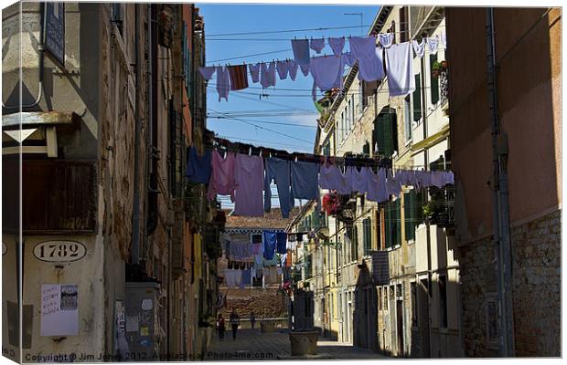Venetian street on washing day Canvas Print by Jim Jones