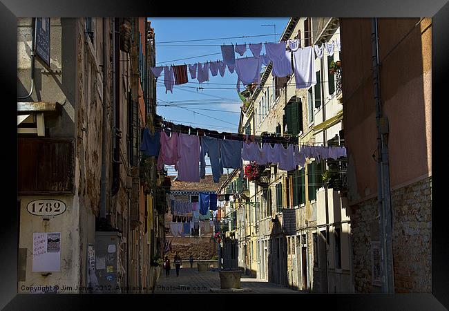 Venetian street on washing day Framed Print by Jim Jones