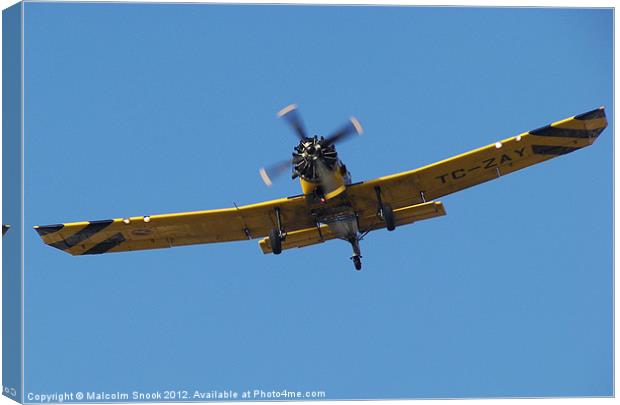 Low flying cropsprayer Canvas Print by Malcolm Snook