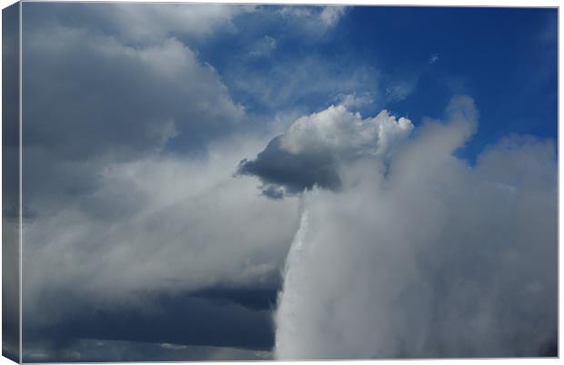 Old Faithful merging with clouds, Yellowstone Canvas Print by Claudio Del Luongo