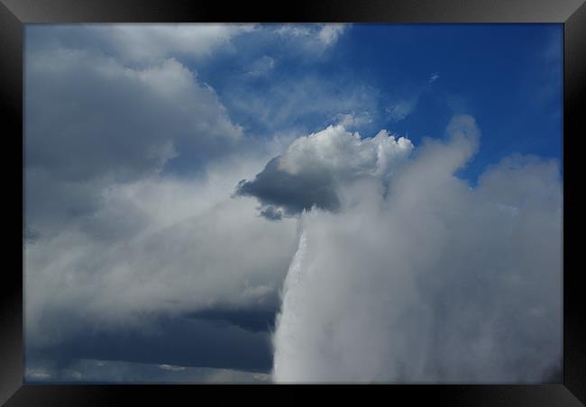 Old Faithful merging with clouds, Yellowstone Framed Print by Claudio Del Luongo