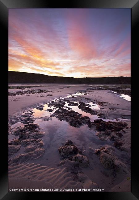 Sunrise on the beach Framed Print by Graham Custance