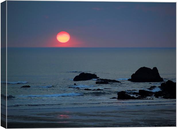 Pink Sun on Blue Beach Canvas Print by Dave Bell