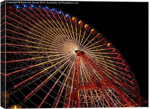 Big wheel at the Feria Canvas Print by Malcolm Snook
