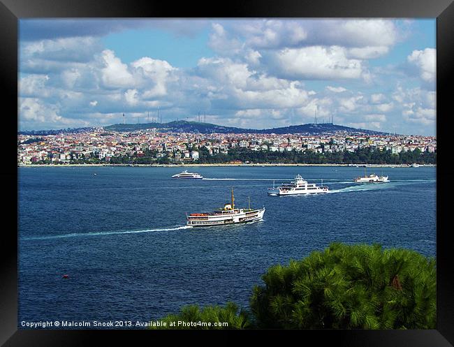 Ferries cross the Bosphorus Framed Print by Malcolm Snook